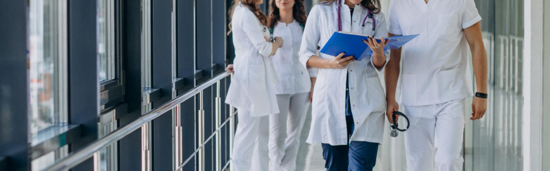 team-young-specialist-doctors-standing-corridor-hospital.jpg